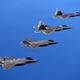 Illustration for article titled Cool photos of F-22s and F-35s flying together for the first time